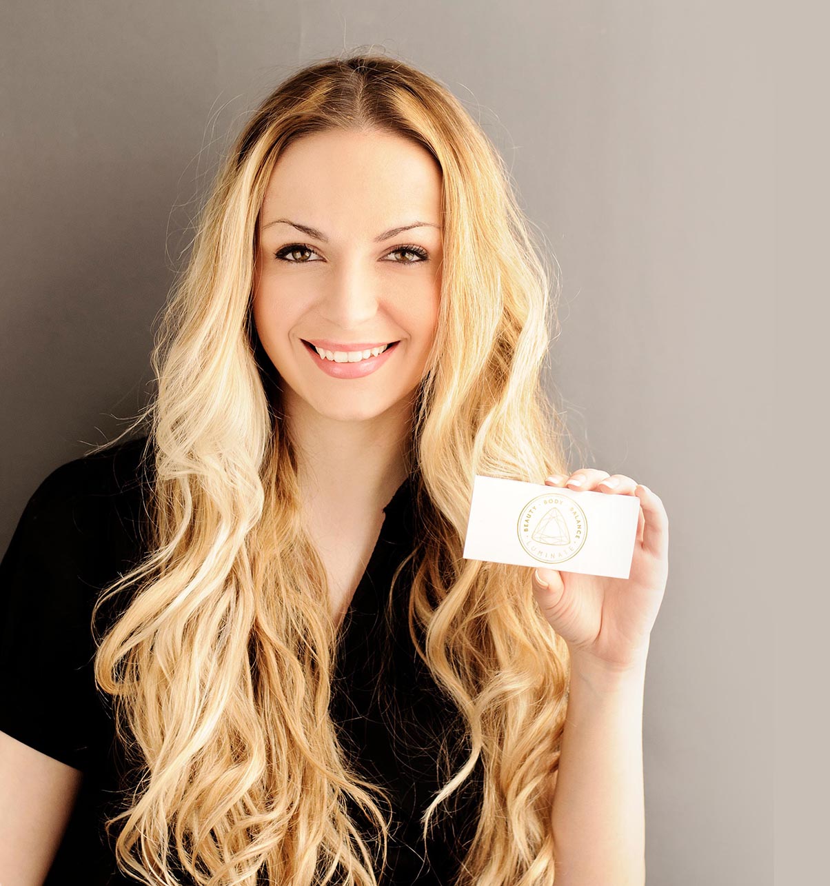 Girl holding blank membership card